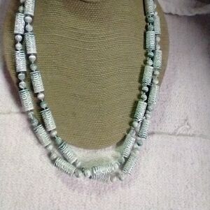 Long beaded greenish greyish necklace